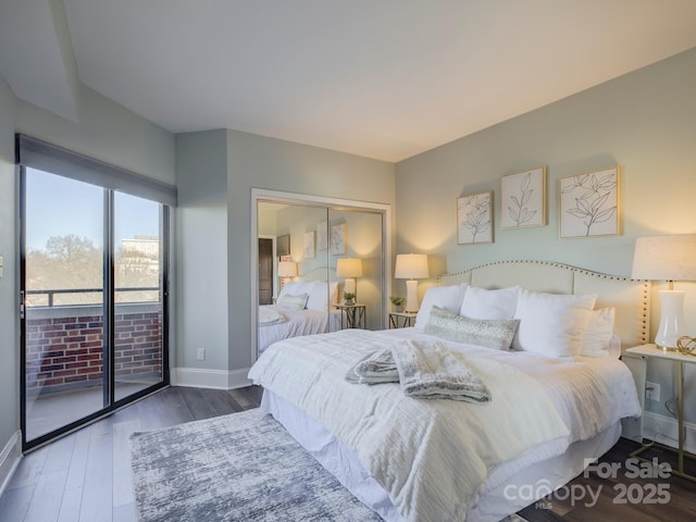 bedroom featuring access to exterior, a closet, and hardwood / wood-style floors