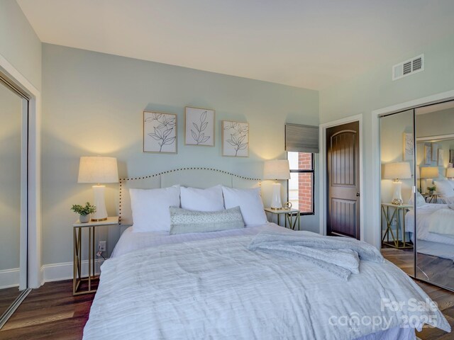 224 N Poplar St Unit 19, Charlotte, NC 28202 - bedroom featuring dark wood finished floors and a closet