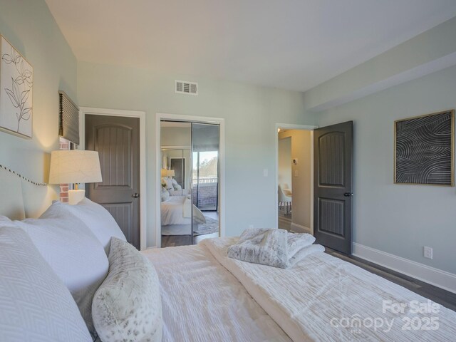 224 N Poplar St Unit 19, Charlotte, NC 28202 - bedroom with a closet and wood finished floors