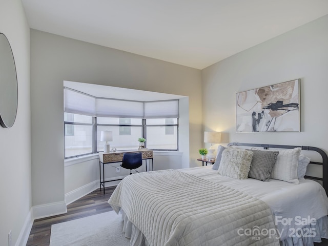 bedroom featuring dark hardwood / wood-style floors