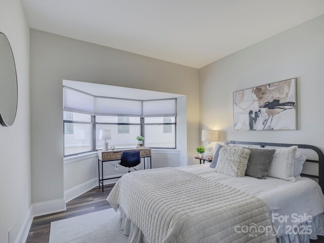 224 N Poplar St Unit 19, Charlotte, NC 28202 - bedroom with wood finished floors and baseboards