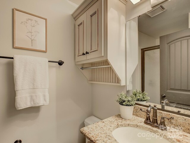 224 N Poplar St Unit 19, Charlotte, NC 28202 - bathroom with vanity and toilet