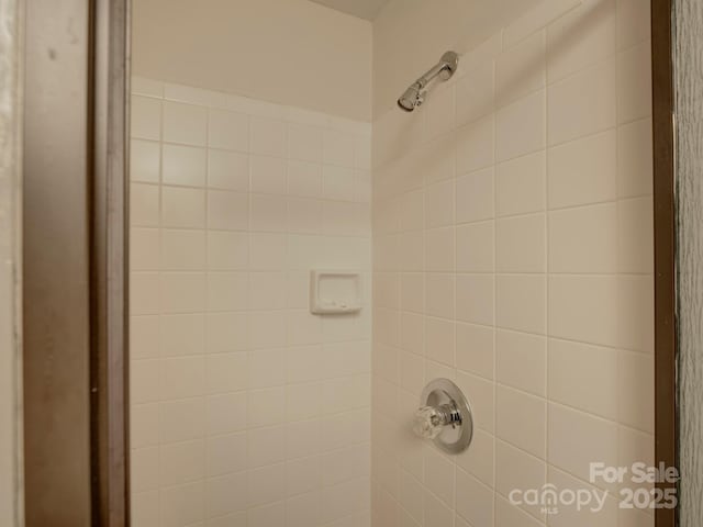 interior space featuring a tile shower