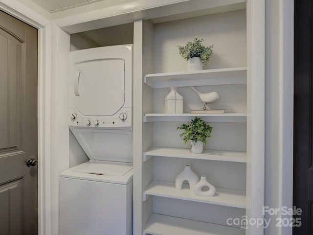 laundry area with stacked washer and clothes dryer