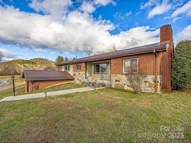 ranch-style home with a front lawn