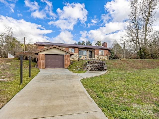 ranch-style home with a front yard and a garage