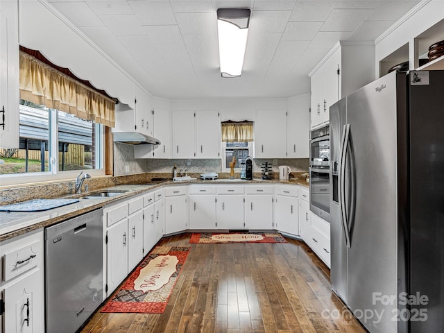 kitchen with white cabinets, light stone counters, sink, and appliances with stainless steel finishes