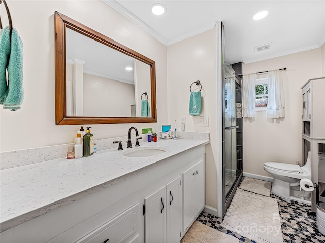 bathroom featuring walk in shower, tile patterned flooring, crown molding, toilet, and vanity