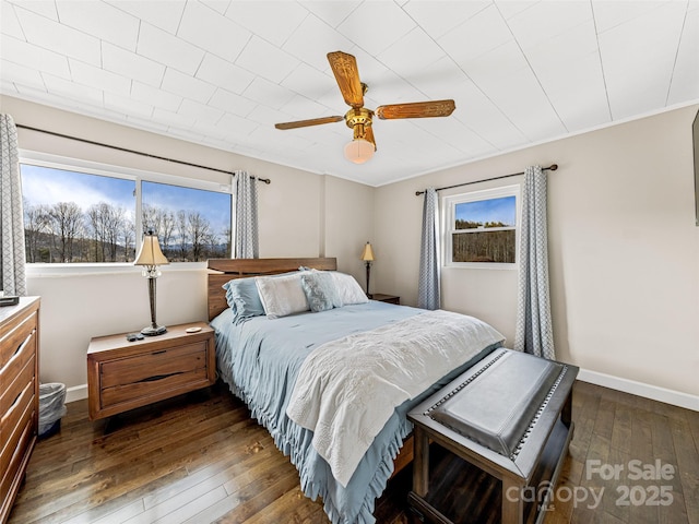 bedroom with ceiling fan and dark wood-type flooring