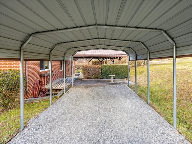 view of parking with a carport and a lawn