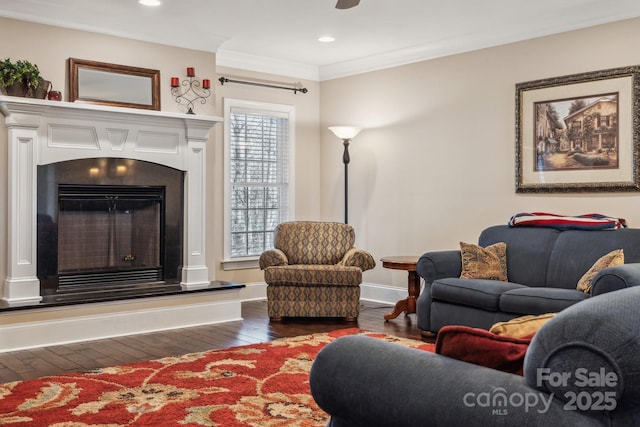 living room with crown molding, a healthy amount of sunlight, and dark hardwood / wood-style floors