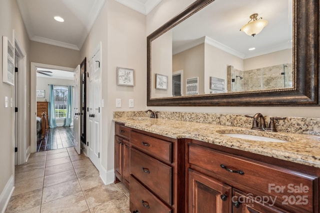 bathroom with walk in shower, vanity, tile patterned flooring, ceiling fan, and crown molding