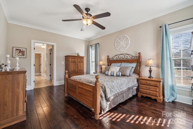 bedroom with ceiling fan, dark wood-type flooring, multiple windows, and ornamental molding