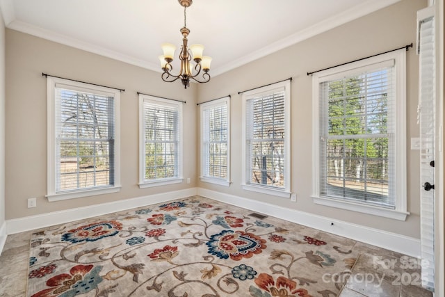 dining area with a chandelier, crown molding, and plenty of natural light