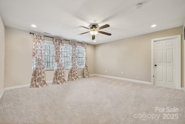 carpeted spare room with recessed lighting, visible vents, baseboards, and a ceiling fan