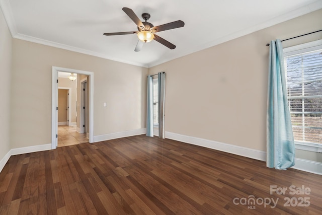 unfurnished room with baseboards, wood finished floors, a ceiling fan, and crown molding