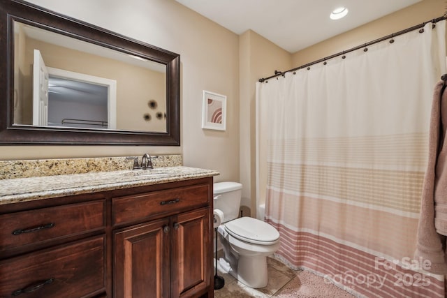 bathroom featuring tile patterned floors, toilet, vanity, and a shower with curtain