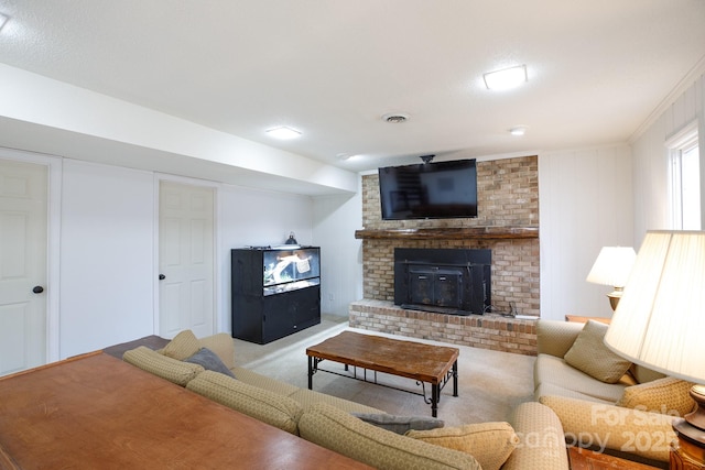 living room with light colored carpet, crown molding, and a fireplace