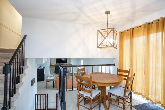 dining room with a notable chandelier and light hardwood / wood-style floors