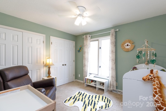 office area featuring ceiling fan and light colored carpet