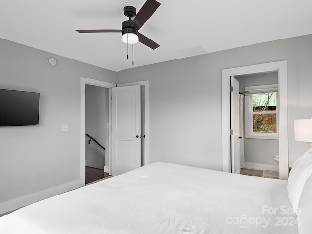 bedroom with ceiling fan and ensuite bath