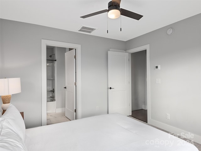 bedroom with ensuite bathroom and ceiling fan