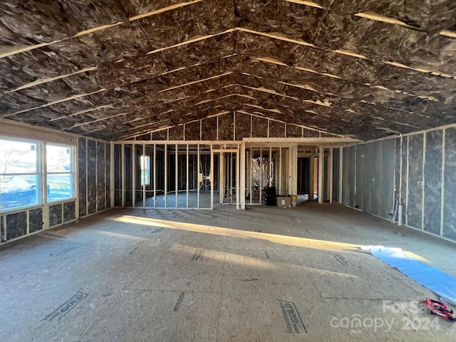 miscellaneous room with lofted ceiling