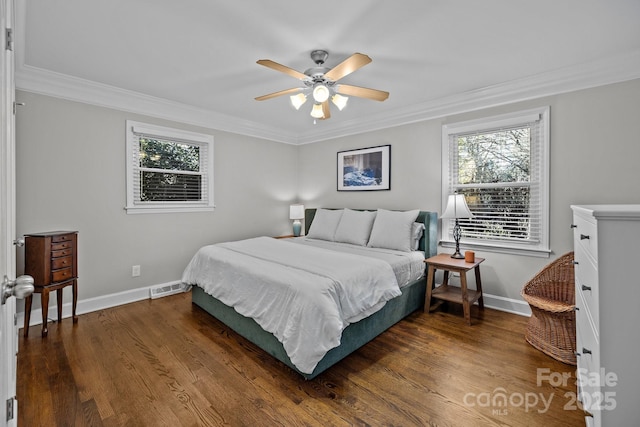 bedroom featuring ceiling fan, crown molding, and dark wood-type flooring