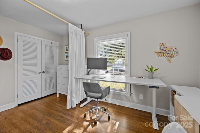 office with dark hardwood / wood-style flooring