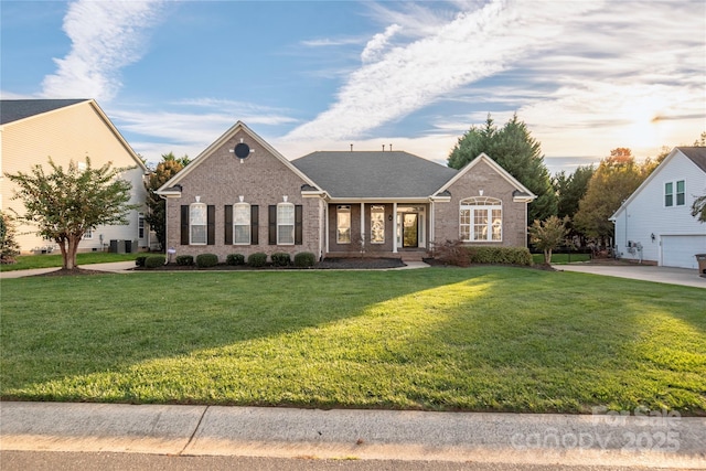 view of front of home with a front lawn and cooling unit