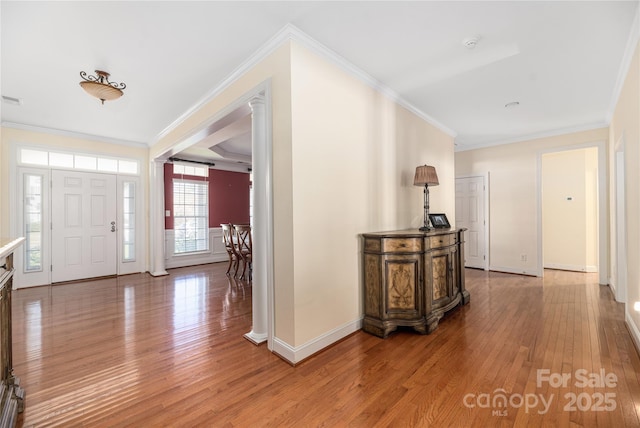 foyer featuring crown molding and wood-type flooring