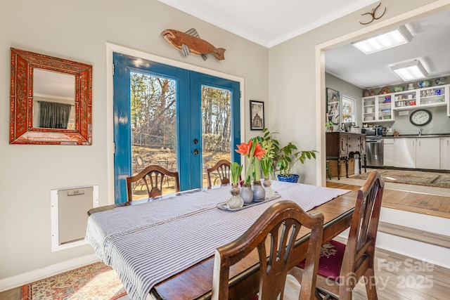 dining room with sink and french doors