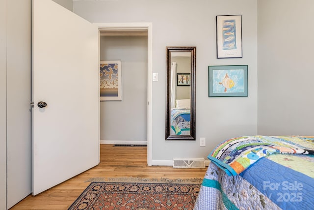 bedroom with wood-type flooring