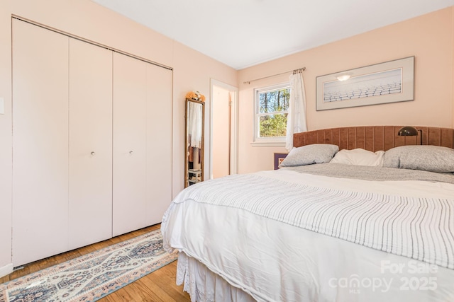 bedroom with a closet and light wood-type flooring