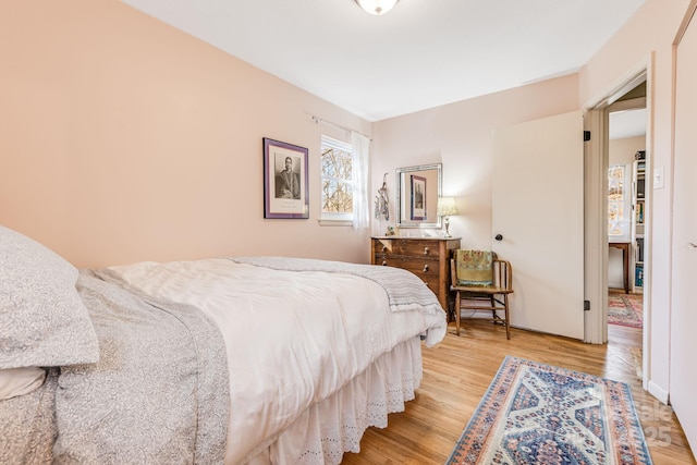 bedroom with light hardwood / wood-style flooring