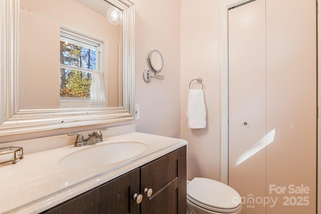 bathroom with vanity and toilet