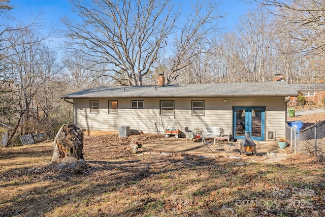 back of property featuring french doors and a patio