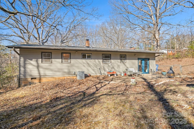 rear view of house with a patio area and french doors