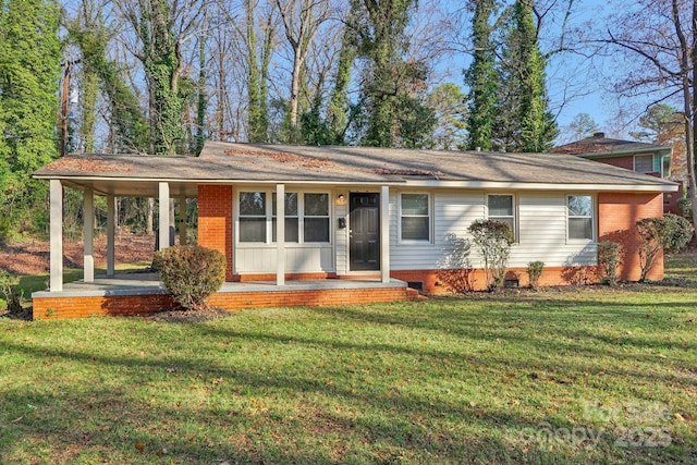 ranch-style home featuring a front yard