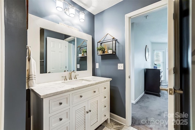 bathroom with vanity and a textured ceiling