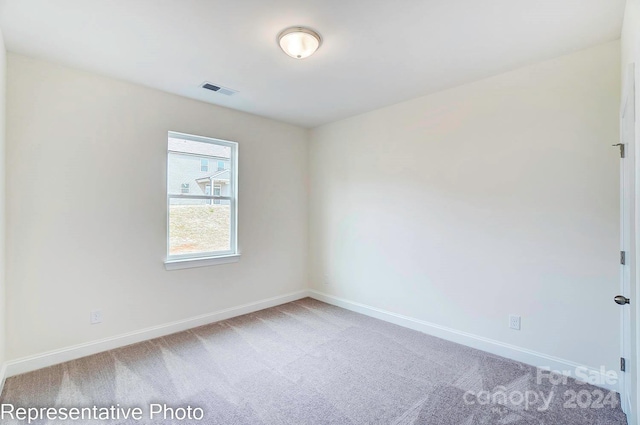 unfurnished room featuring carpet flooring