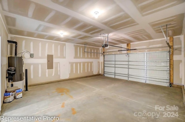 garage featuring electric panel and a garage door opener