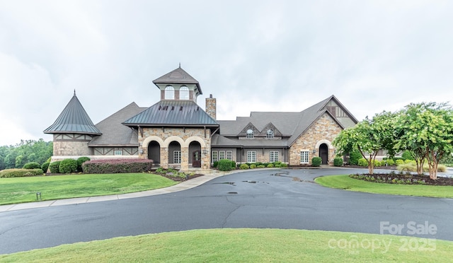 view of property featuring aphalt driveway