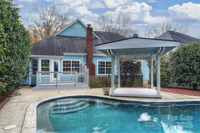 rear view of house featuring a patio area and ceiling fan