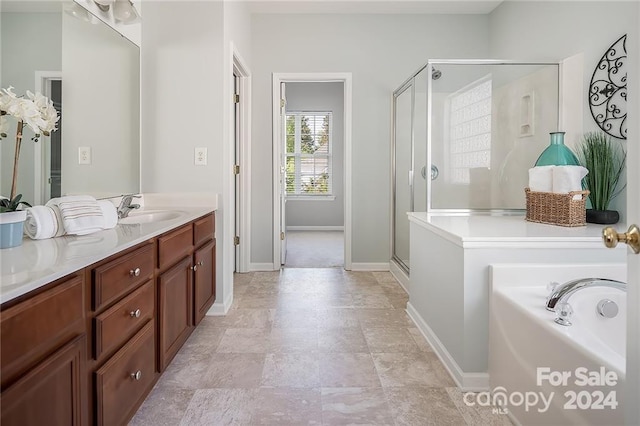 bathroom featuring vanity and plus walk in shower