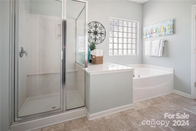 bathroom with separate shower and tub