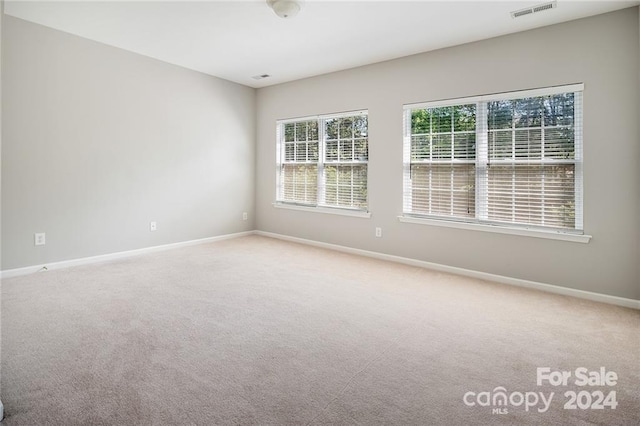 empty room with carpet flooring