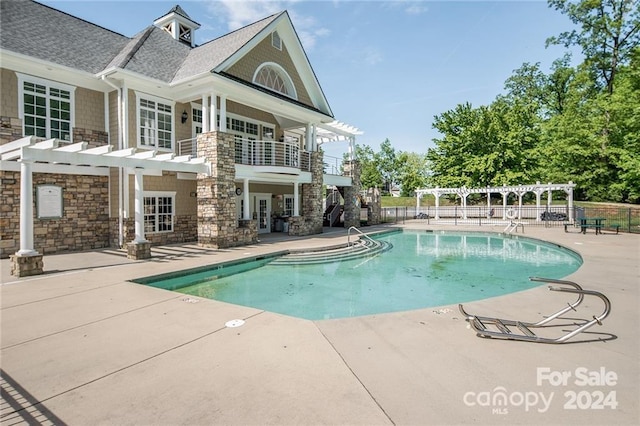 view of pool featuring a pergola and a patio