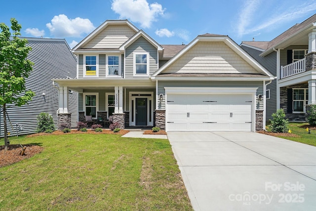 5230 Verona Rd Unit 80, Charlotte, NC 28213 - craftsman-style home featuring a garage, driveway, covered porch, a front yard, and stone siding