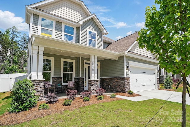 5230 Verona Rd Unit 80, Charlotte, NC 28213 - craftsman-style home with a porch, driveway, an attached garage, stone siding, and a shingled roof